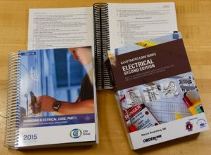 a close-up photo of three Electrical Code manuals