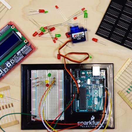 overhead view of a breadboard, logic board, some diodes and microchips