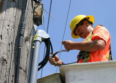electrical worker connecting power lines
