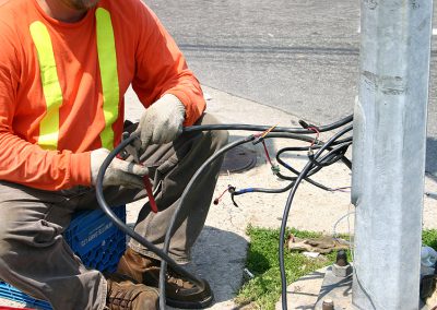 electrical worker repairing street signal wiring