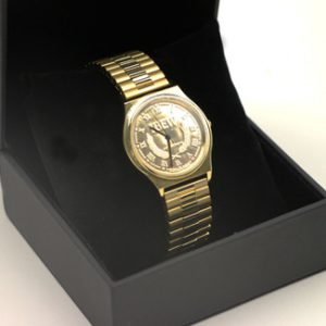 Photo of a gold coloured watch in a black box