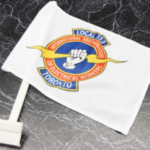 Photo of a white vehicle-mounted window flag with the IBEW Local 353 Toronto logo in full colours