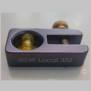 Photo of a purple No-Dog Level with "IBEW Local 353" in white text on the side